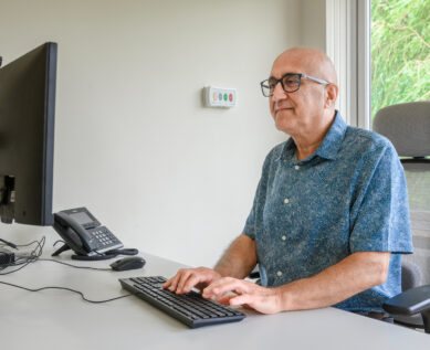 A consultant at their desk