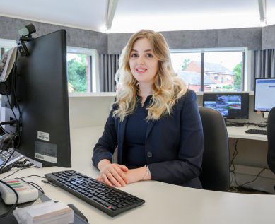 A receptionist at their desk