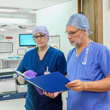 Surgeons in discussion outside theatre