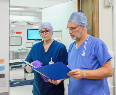 Surgeons in discussion outside theatre