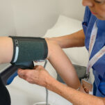 A nurse takes a patient's blood pressure