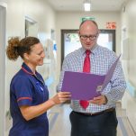 A consultant and nurse in discussion