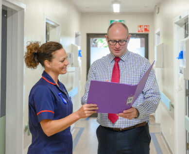 A consultant and nurse in discussion