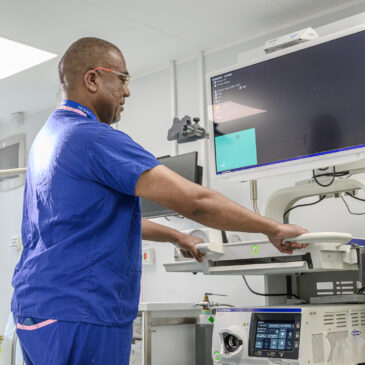 A nurse operates scanning equipment in the Endocrinology Department