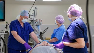 Surgeons treating a patient in theatre