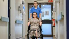 Nurse assisting patient in wheelchair