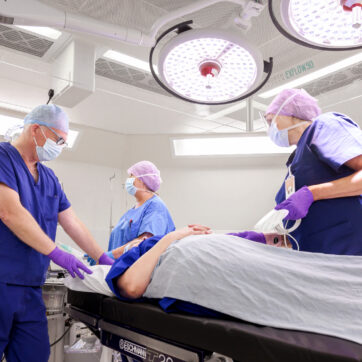 surgeons with patient in New Fostcote Hospital Theatre